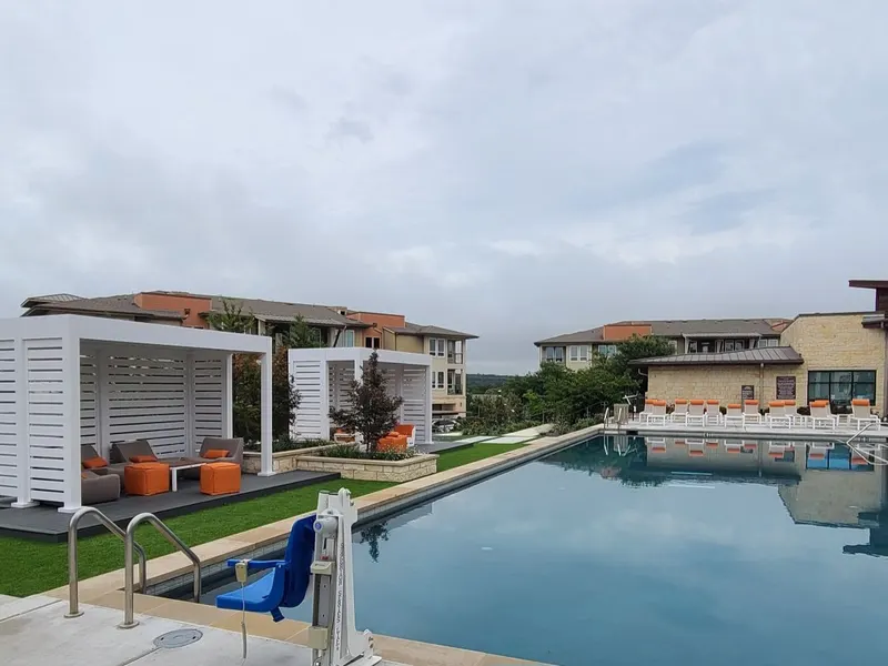 Community pool with shaded cabanas
