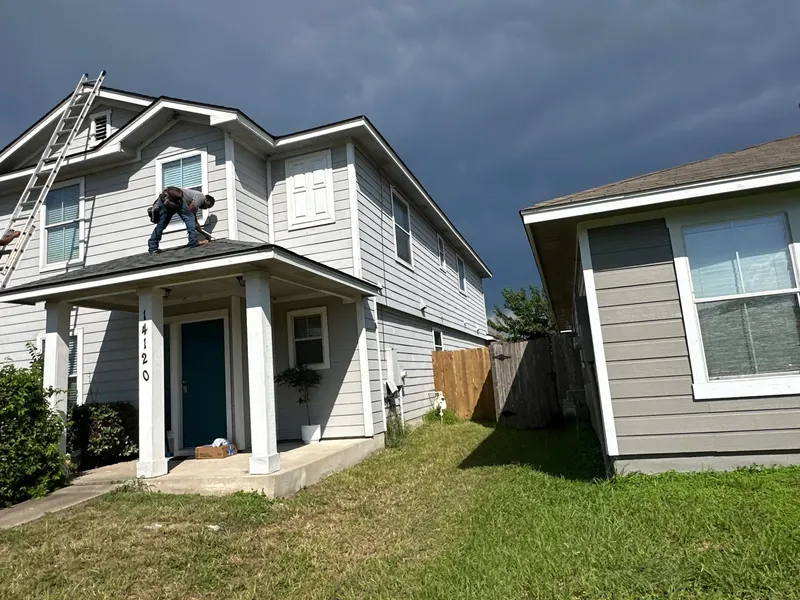 Roofer on a two-story home