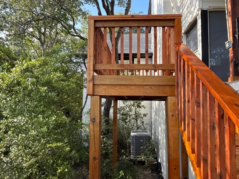 Elevated deck with a new railing